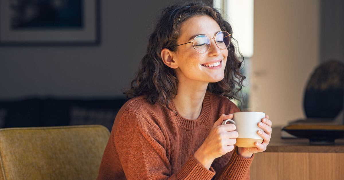 Lady smiling with her coffee