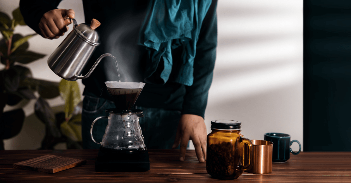 Pour-over filter coffee being brewed with a gooseneck kettle